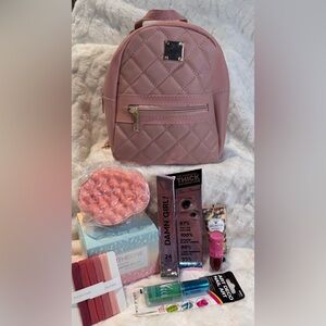 Pink backpack full of beauty & hair products, makeup, Jeffree Star lipstick